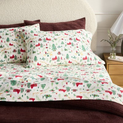 Threshold Holiday Flannel Sheet Set, Sheet set with a white colored background and holiday-themed illustrations of red colored houses,… #color_THRESHOLD Winter Scene