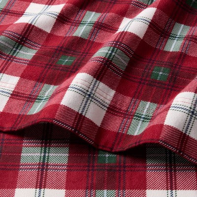 Threshold Holiday Flannel Sheet Set, Red colored tartan plaid sheet set with white colored and green colored accent squares, shown folded… #color_THRESHOLD Tartan