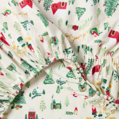 Threshold Holiday Flannel Sheet Set, Cream colored fitted sheet with gathered elastic edge and a small-scale holiday village print… #color_THRESHOLD Winter Scene