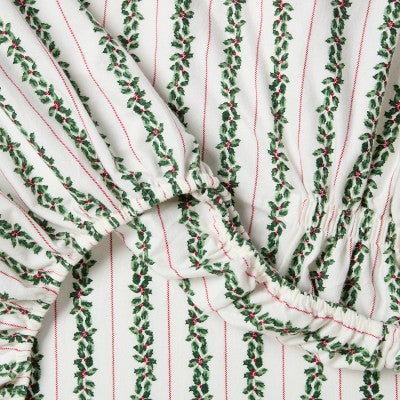 Threshold Holiday Flannel Sheet Set, White colored fitted sheet with vertical green colored holly-garland stripes with red colored berries… #color_THRESHOLD Botanical Stripe