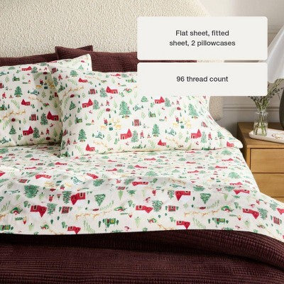 Threshold Holiday Flannel Sheet Set, White colored sheet set with a winter village print featuring red colored houses, green colored trees… #color_THRESHOLD Winter Scene