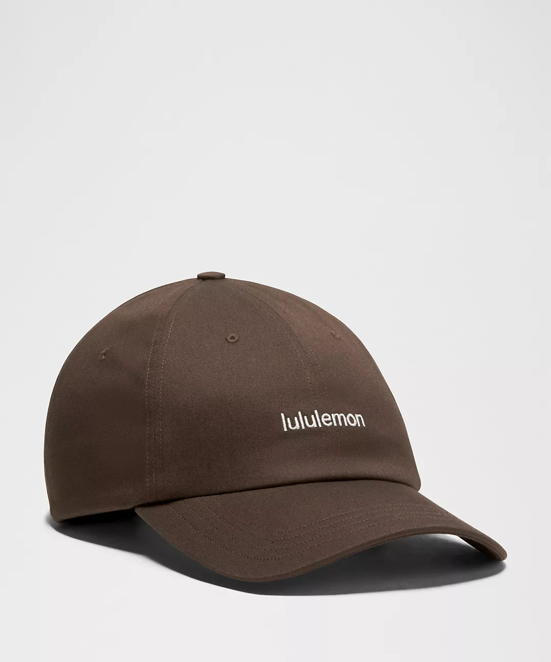 Gorra deportiva casual Lululemon con logo wordmark #color_LL Walnut Crunch/Coconut Ivory