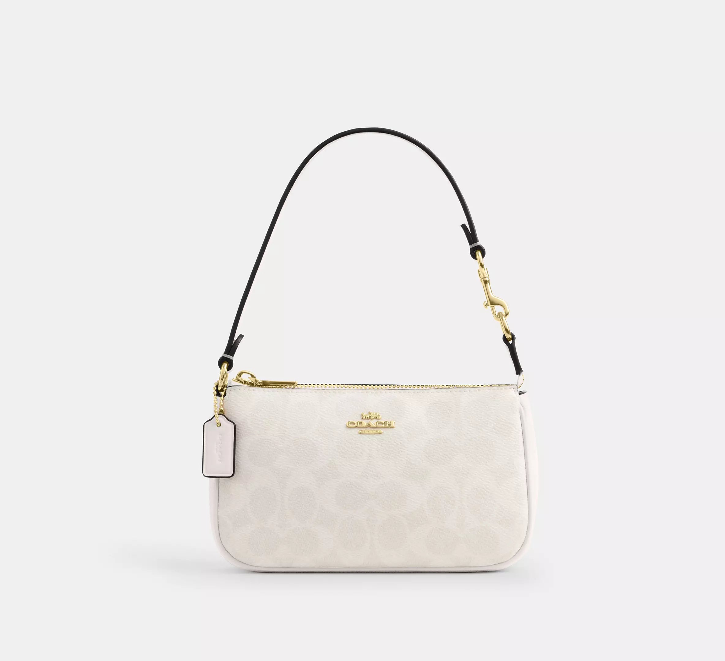 Coach - Nolita 19 | Mini bolsa de mano con prints modernos y canvas de lujo
