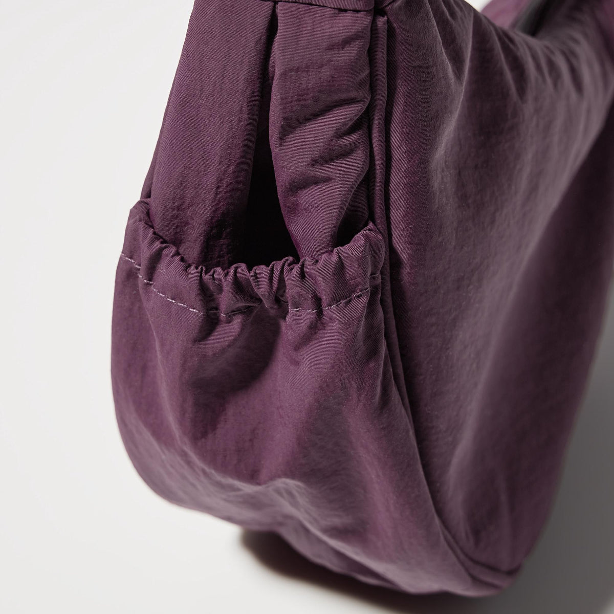 UNIQLO Round Mini Shoulder Bag bolsillo lateral para guardar correa
